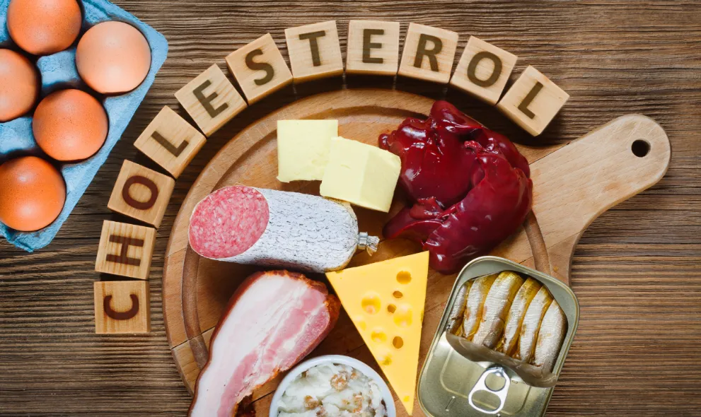 High cholesterol foods on cutting board