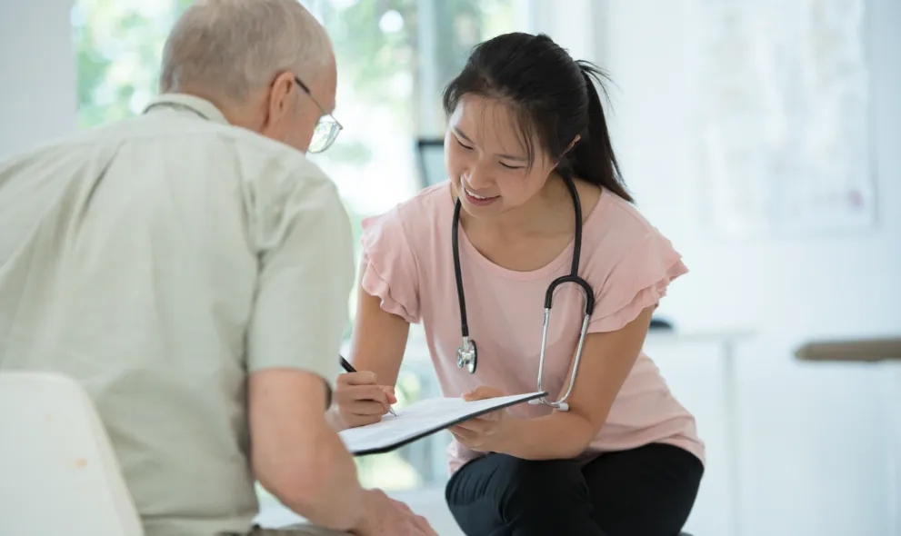 Patient discussing medication options with doctor