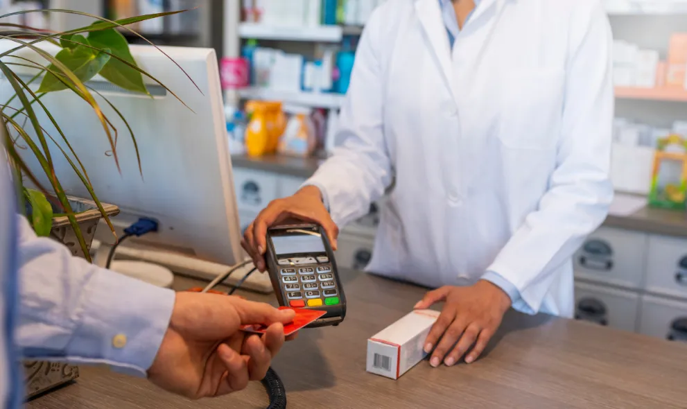 Patient paying for prescription at pharmacy