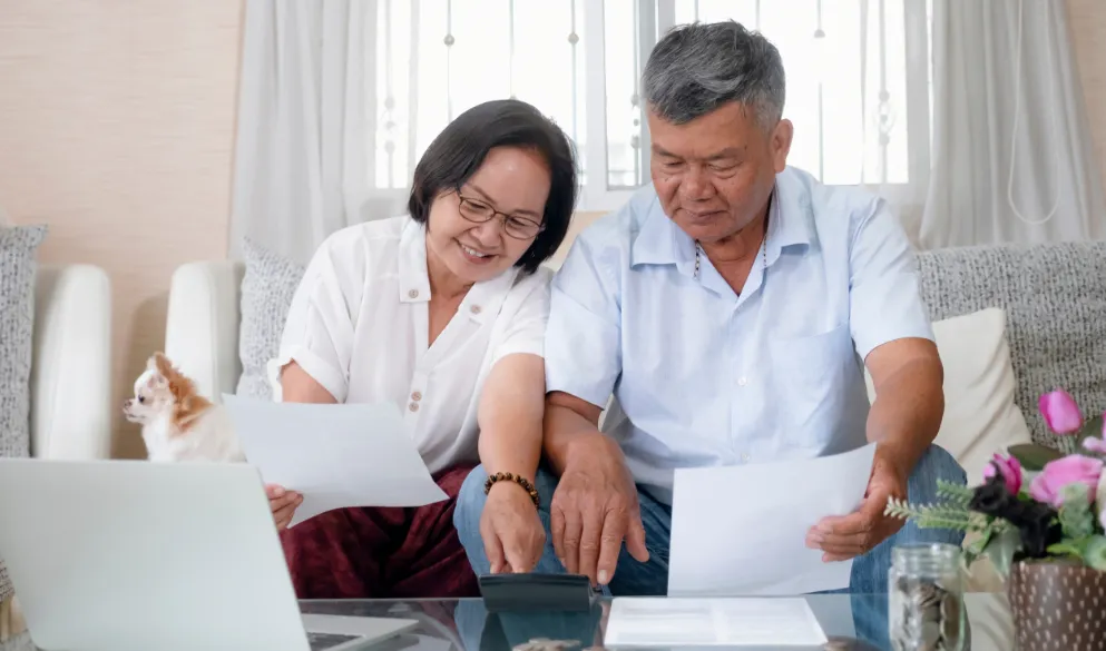 Senior couple calculating home finances