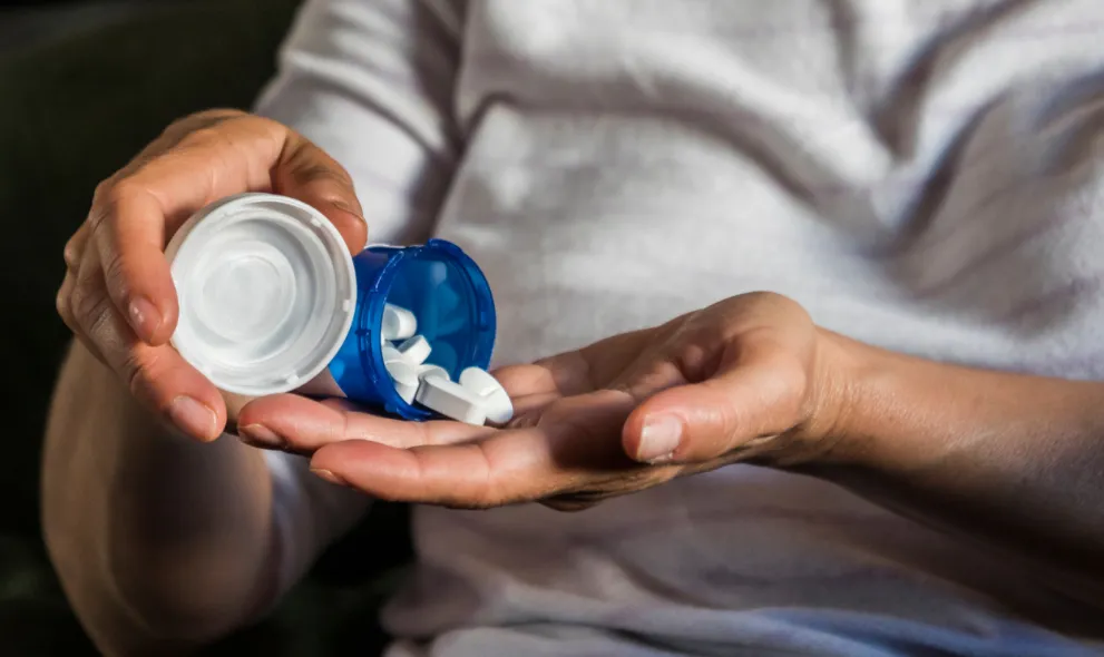 Woman taking pills